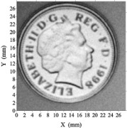 An ultrasonic "photograph" of the back-side of an English pound coin acquired in air using a focussed BAT-3 transducer.